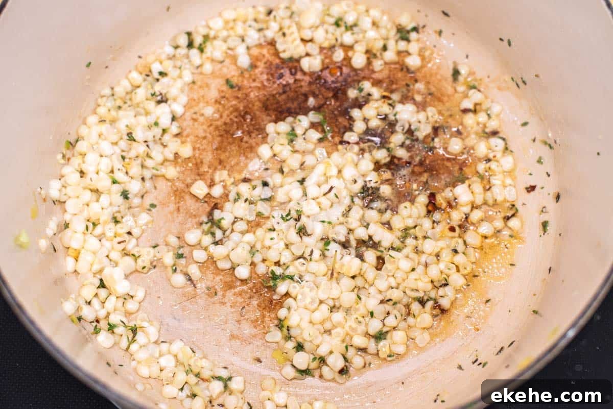 Corn being cooked in Dutch oven.