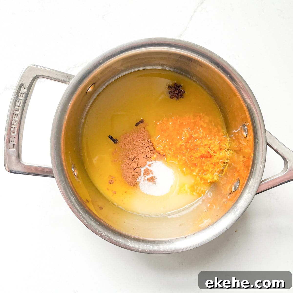 Adding all the sauce ingredients for the tunisian cake to a small saucepan.