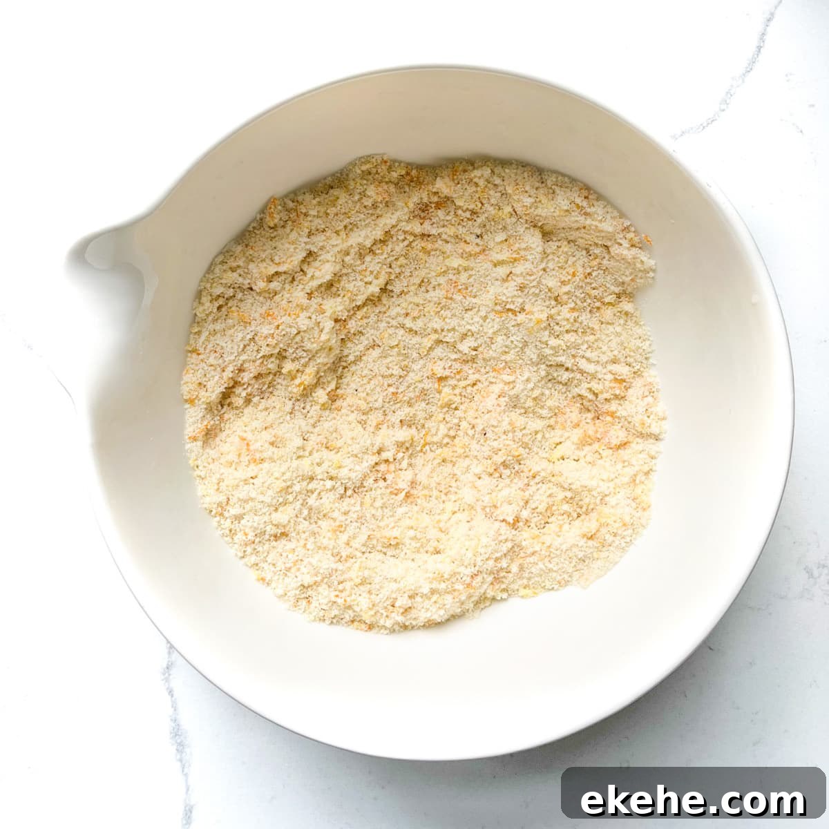Mixed dry ingredients in a large white bowl.