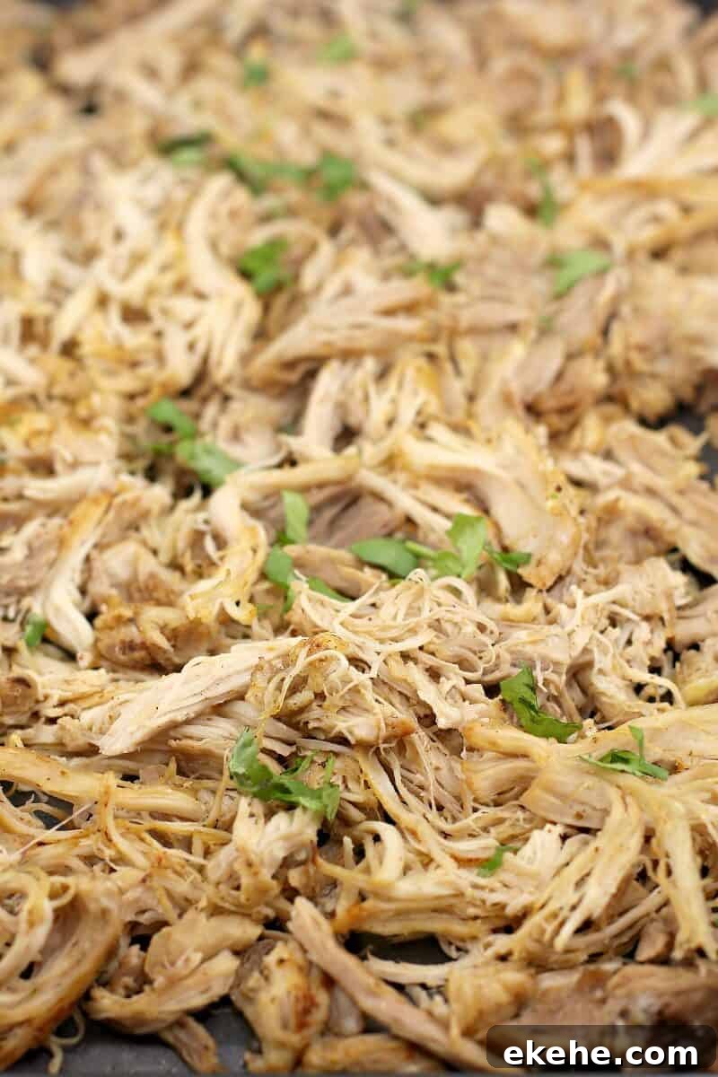 finished chicken topped with cilantro spread on a bake sheet
