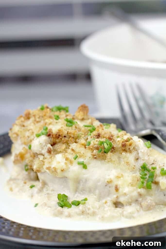 chicken breast on a plate with a fork