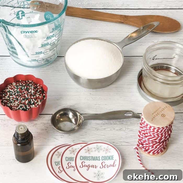 Sugar Scrub ingredients and tools display of coconut oil in measuring cup, organic non-gmo sugar in measuring spoon, red and green nonpareil sprinkles in cup, vanilla oleoresin in dropper bottle, wooden spoon, and custom lid labels