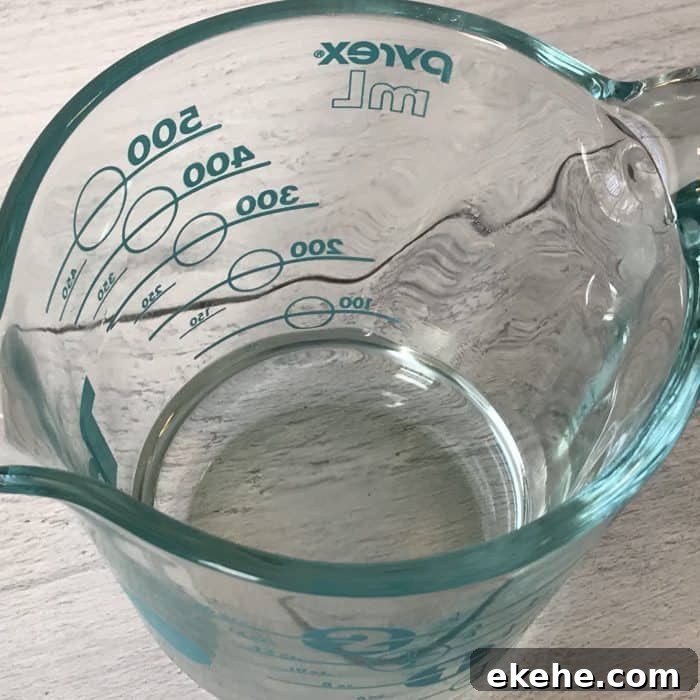 measuring cup with melted coconut oil
