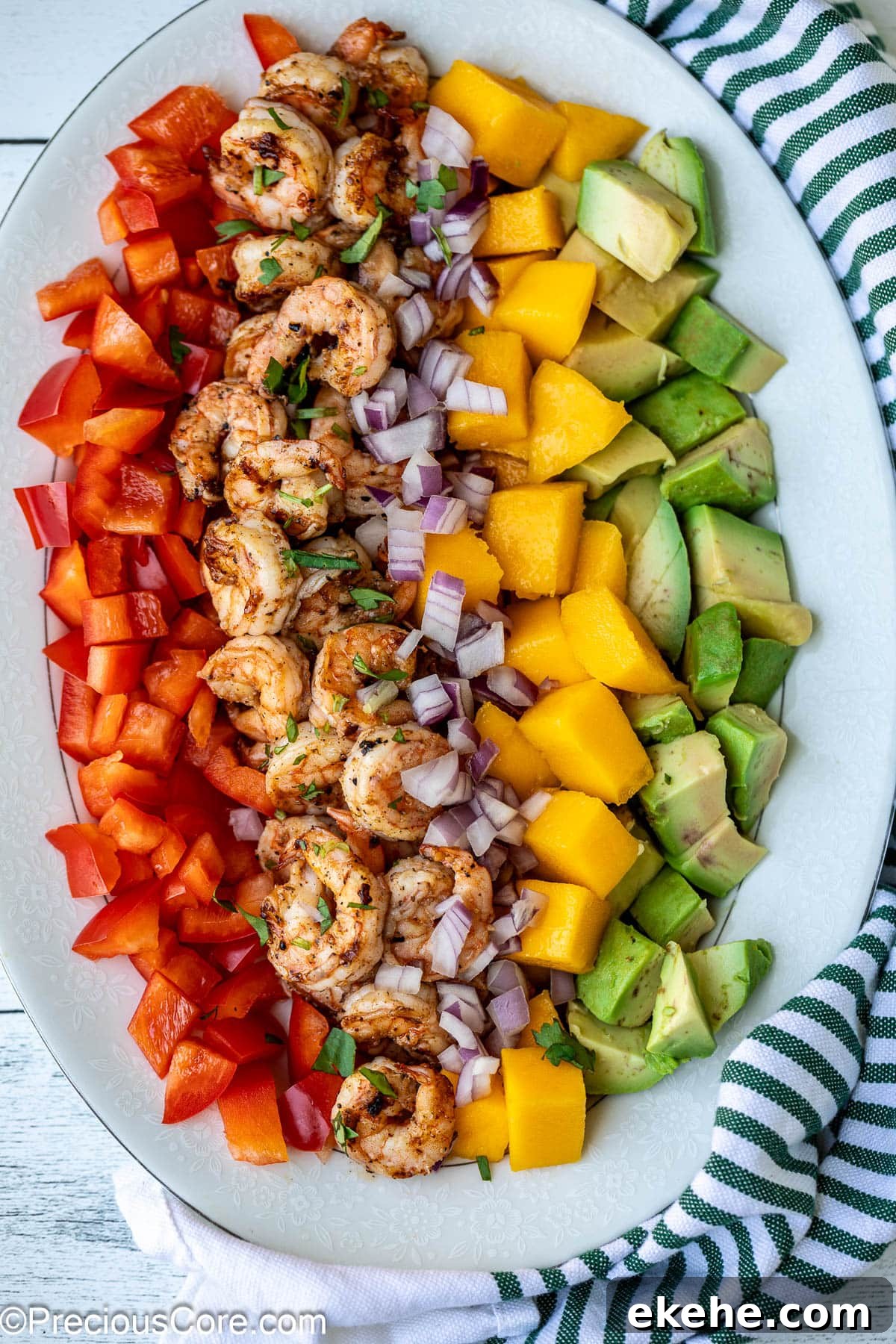 Diced mango, cooked shrimp, avocado, and bell peppers.