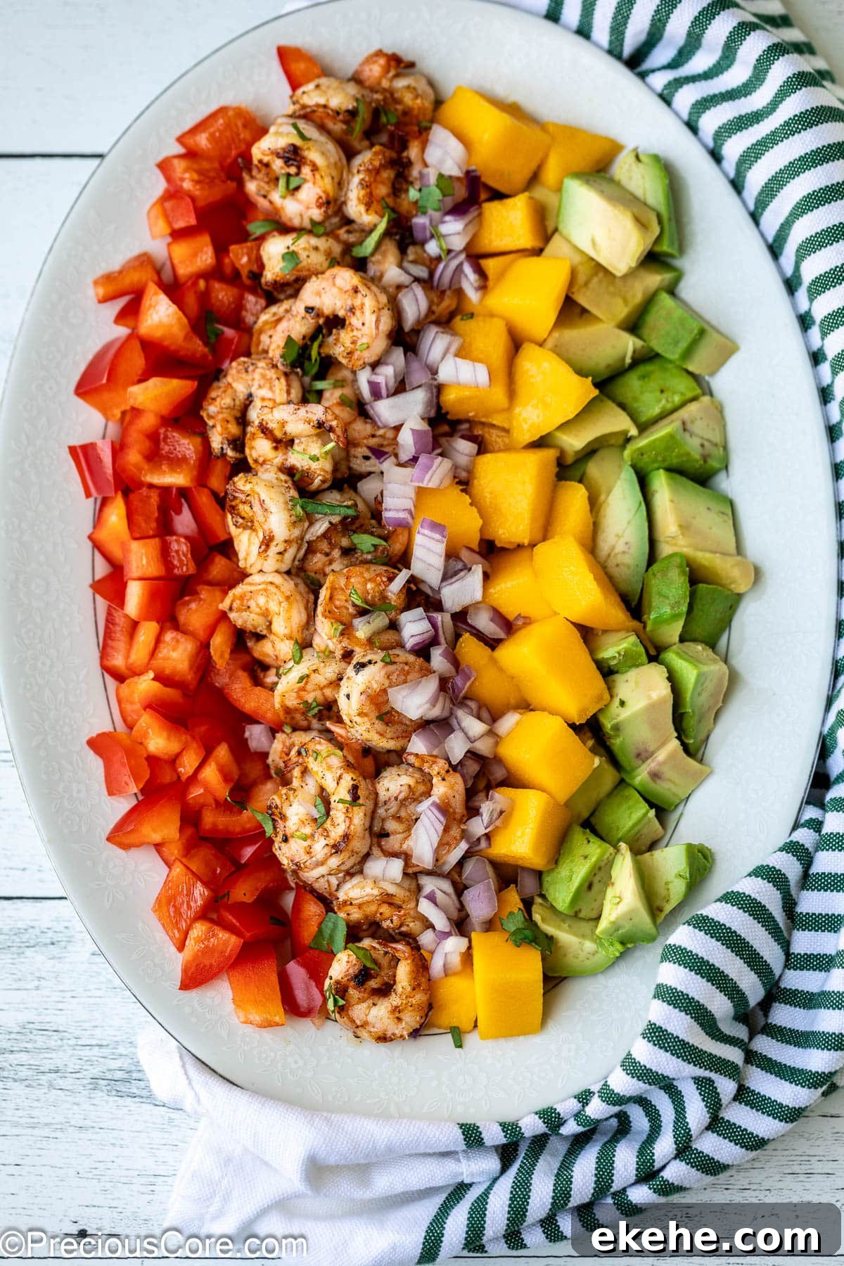 All ingredients for Mango Avocado Salad on a platter.