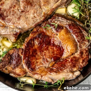 Square image of pan seared ribeye steaks.