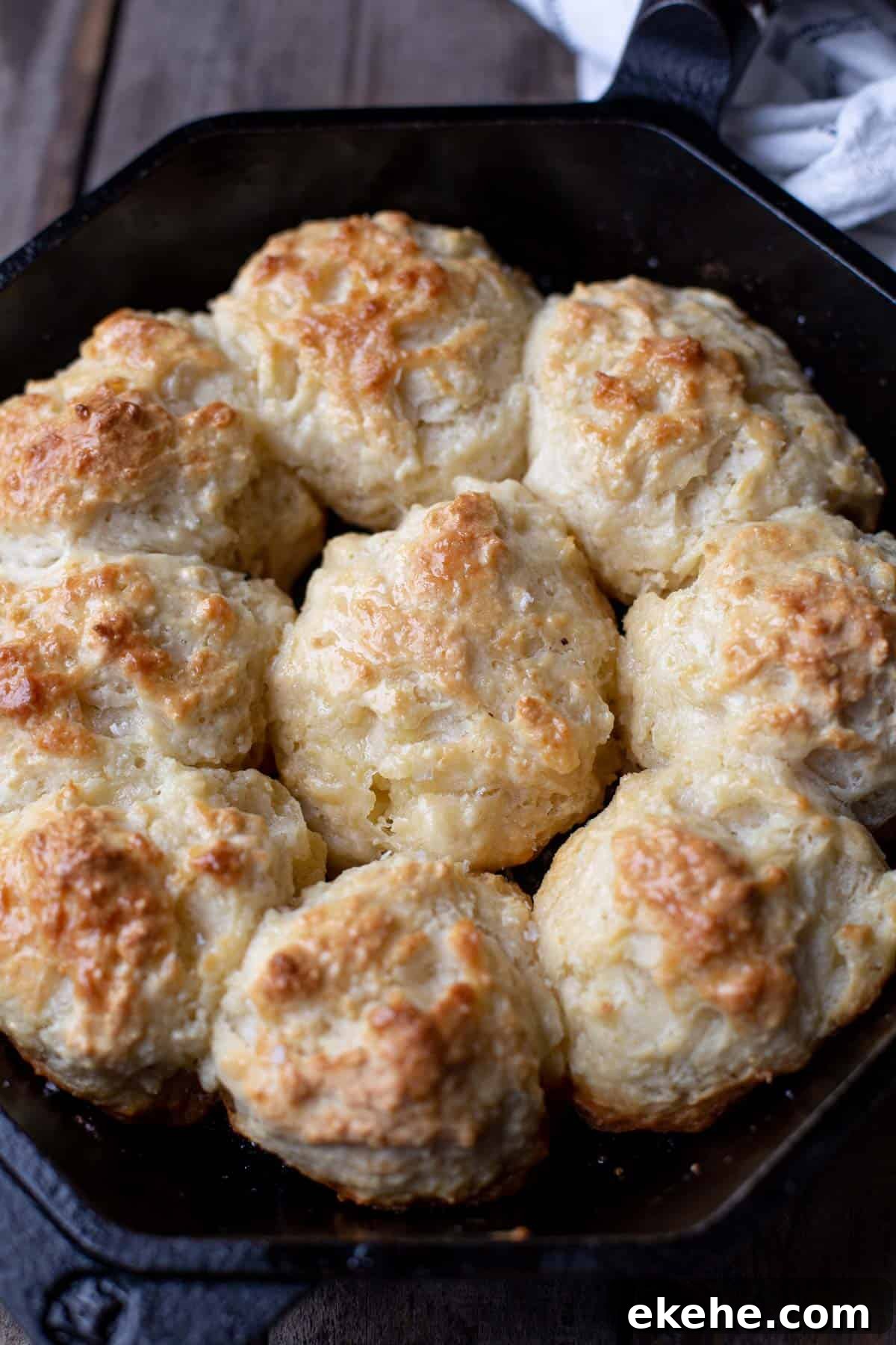 Close up of 9 Drop Biscuits made in a cast iron pan.