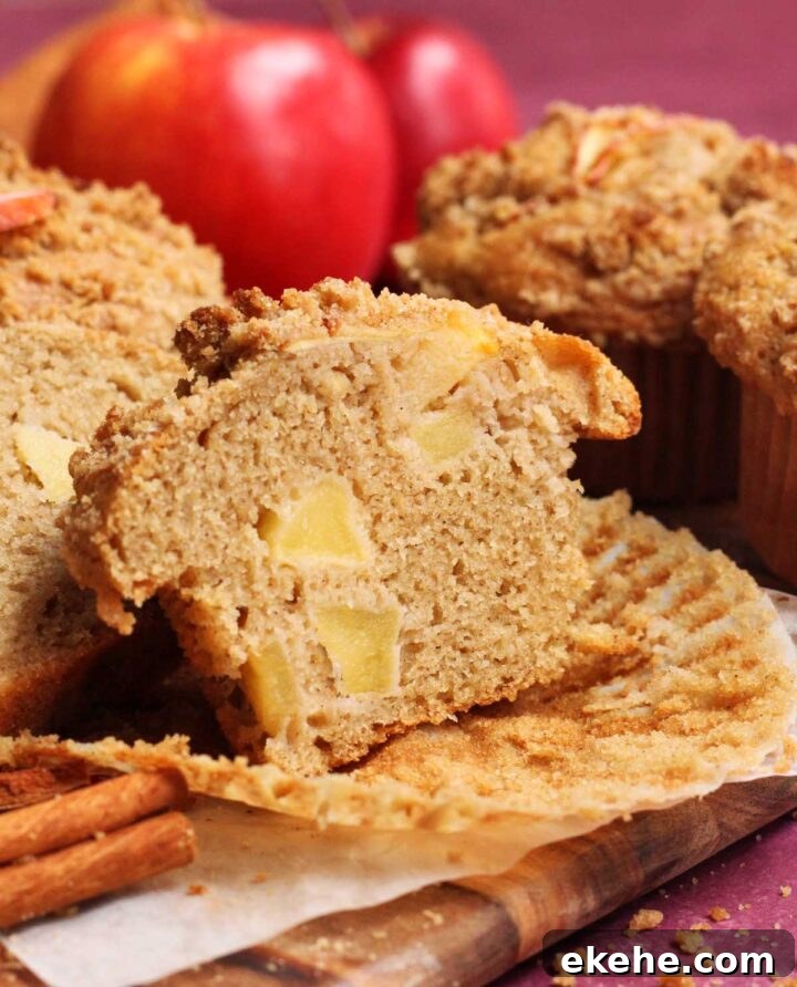 apple cinnamon muffin sliced in half showing cross section