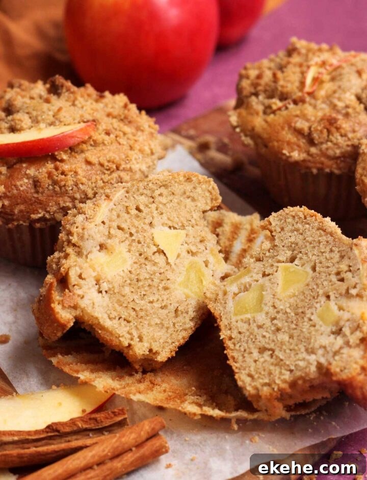 apple cinnamon muffin sliced in half showing cross section