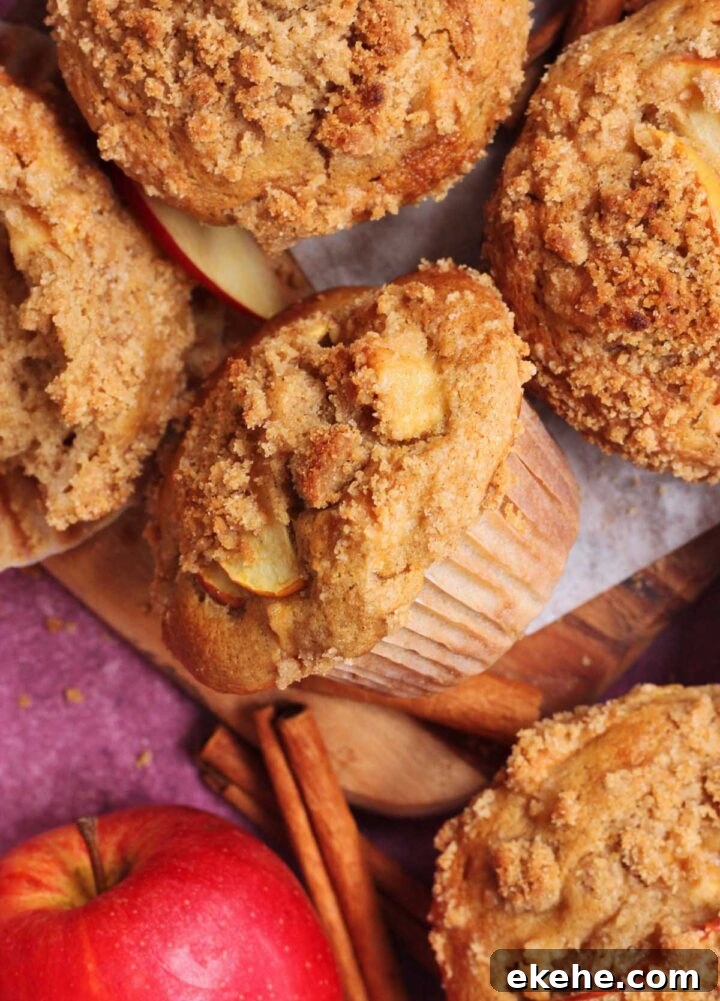 apple cinnamon muffins with cinnamon streusel on cutting board