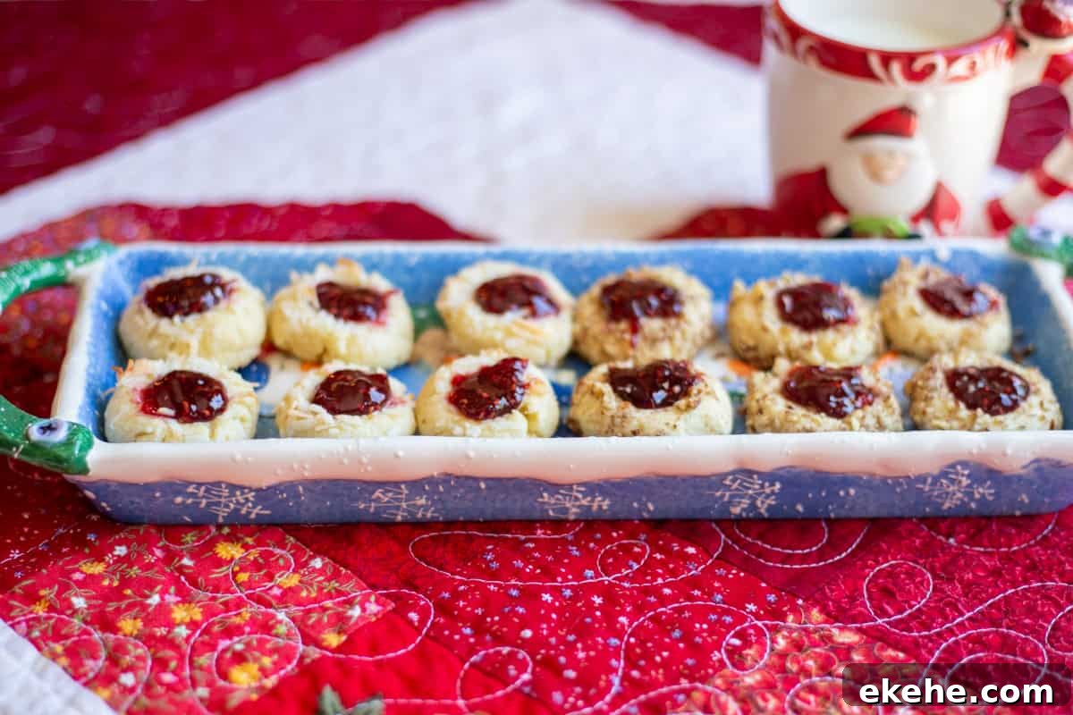 shortbread jam thumbprint cookie son blue plate with mug in background
