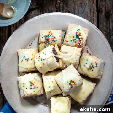 Italian fig cookies on a plate with sprinkles.