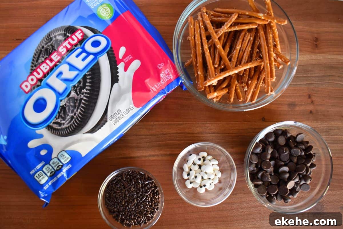 Ingredients for recipe including pretzel rods, chocolate sprinkles and candy eyes.