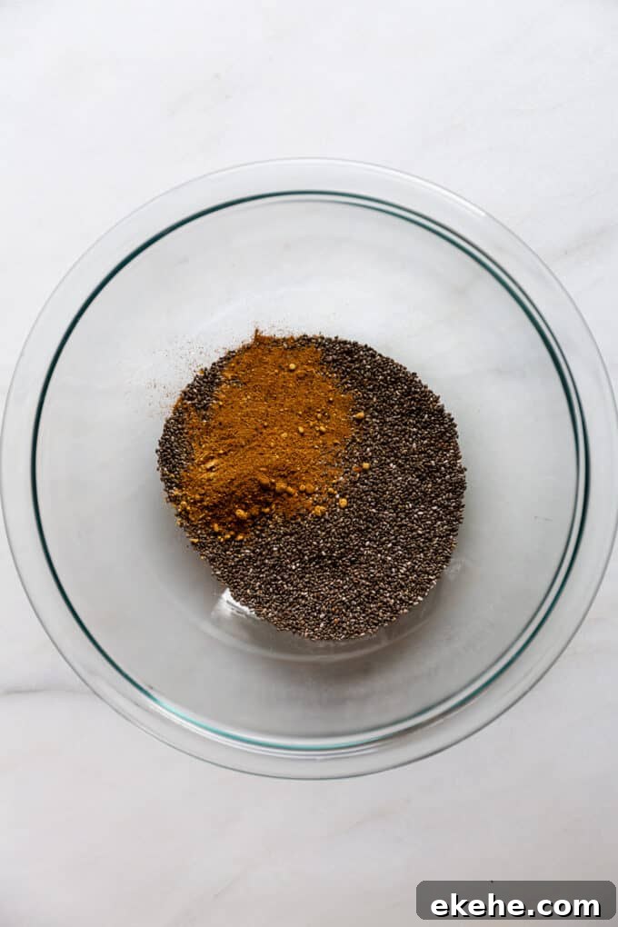 chia seeds and gingerbread spices in a clear mixing bowl
