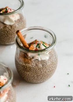 a jar of gingerbread chia pudding with red and green sprinkles