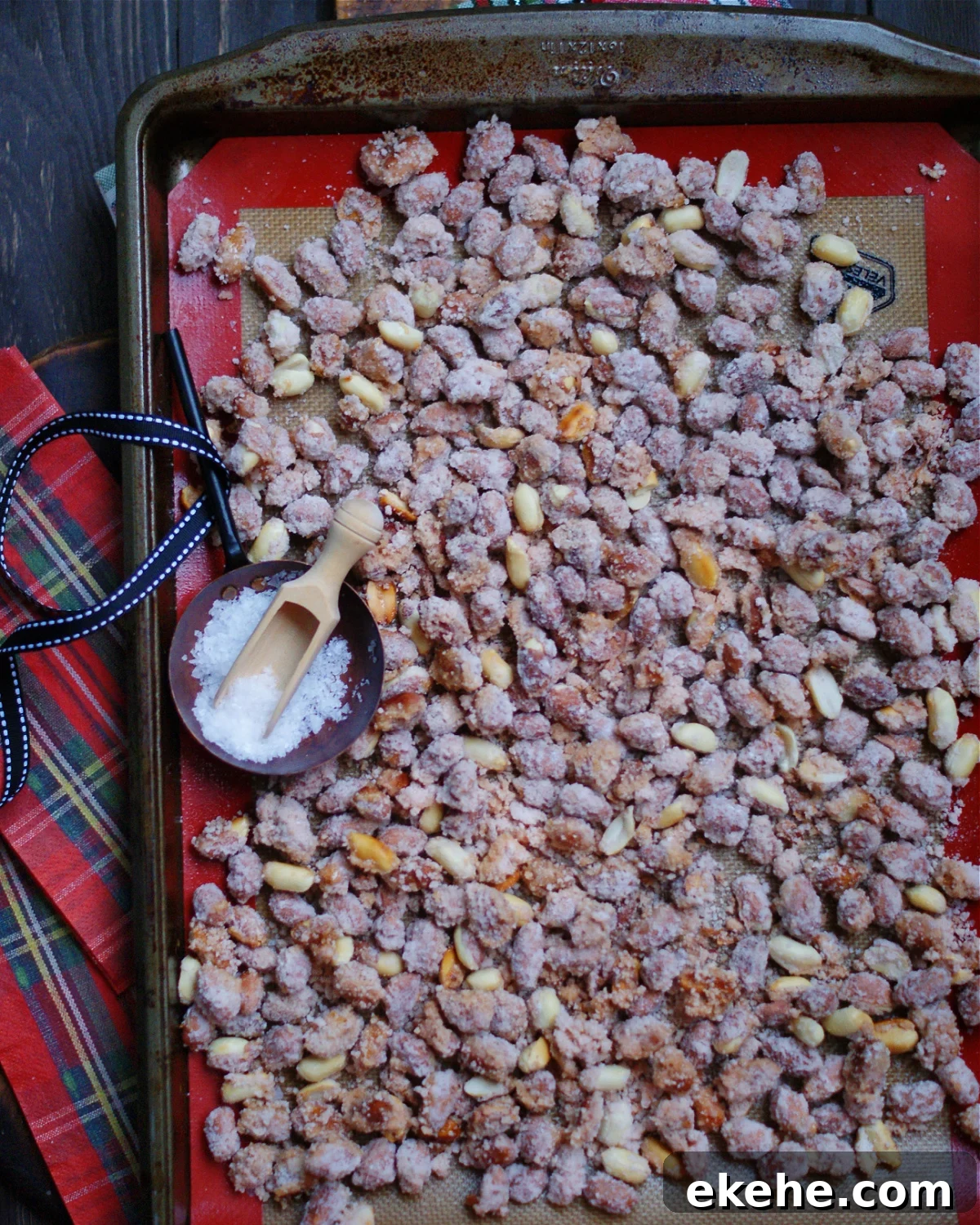 The sugar coating hardens as the peanuts cool on parchment paper or a silicone baking mat