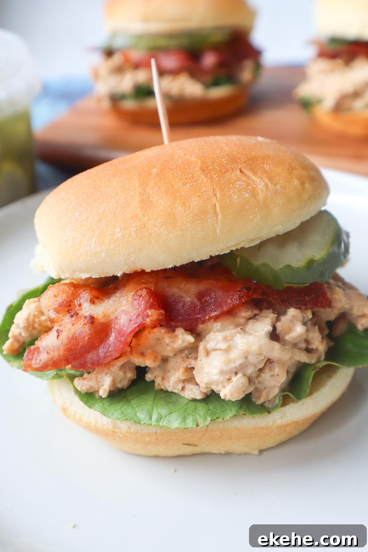 chicken bacon ranch sandwich with ranch shredded chicken, lettuce, bacon, and pickle