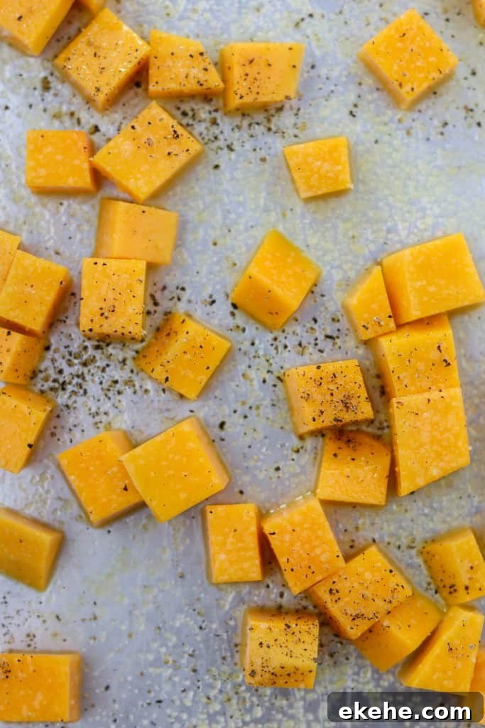 Cubed butternut squash on a sheet pan