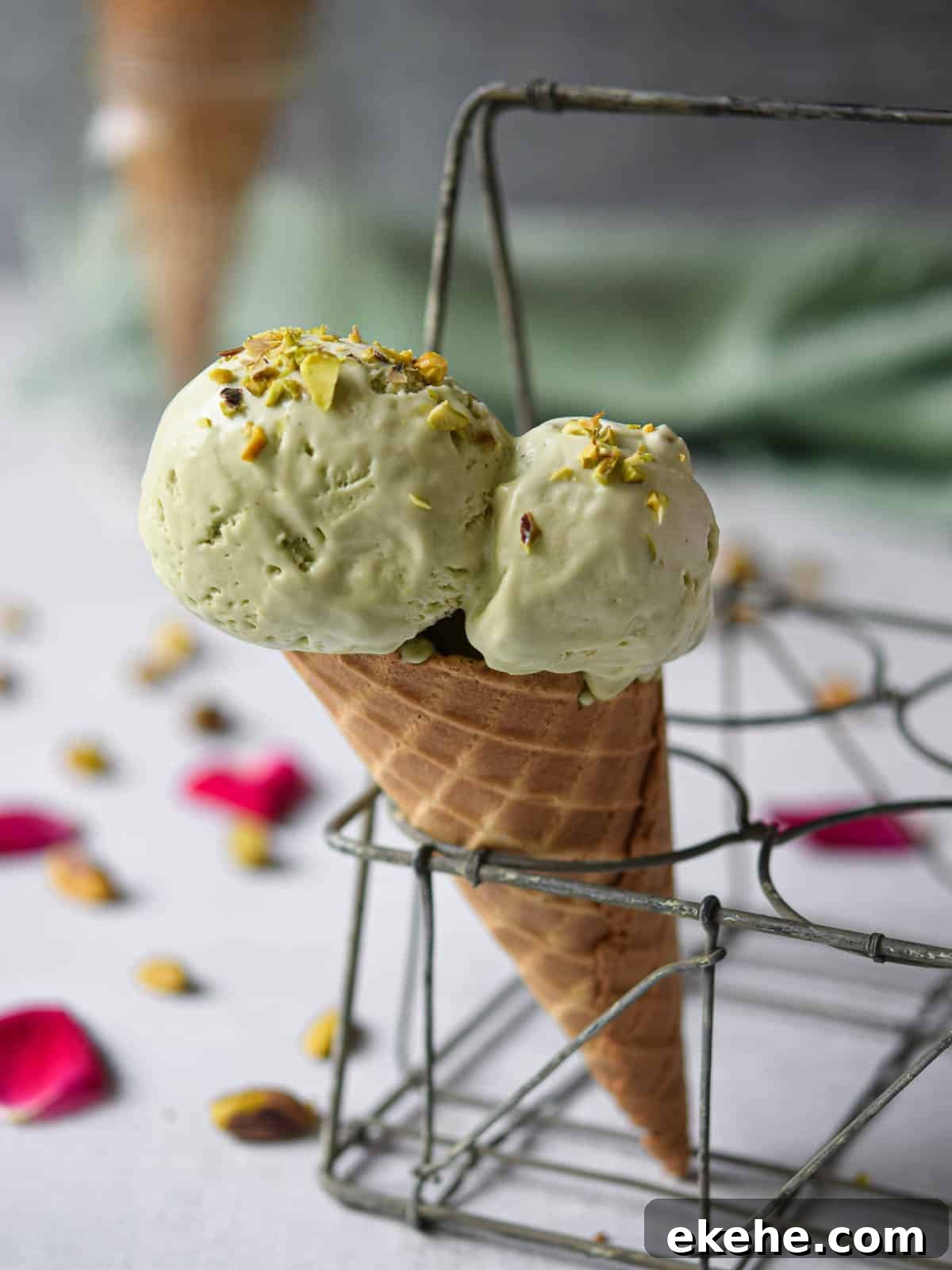 Pistachio ice cream in a waffle cone.