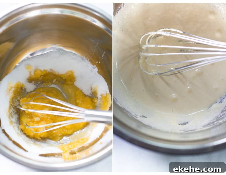 A bowl of egg yolks being whisked with sugar and then whisked with vanilla extract.