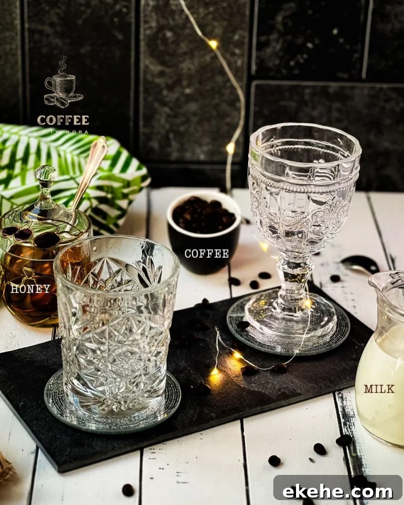 Ingredients for making an iced Honey latte - Honey, Coffee, Milk, and ice cubes