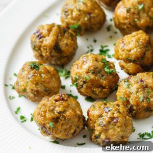 A platter with Baked Chicken Kofta garnished with chopped cilantro.