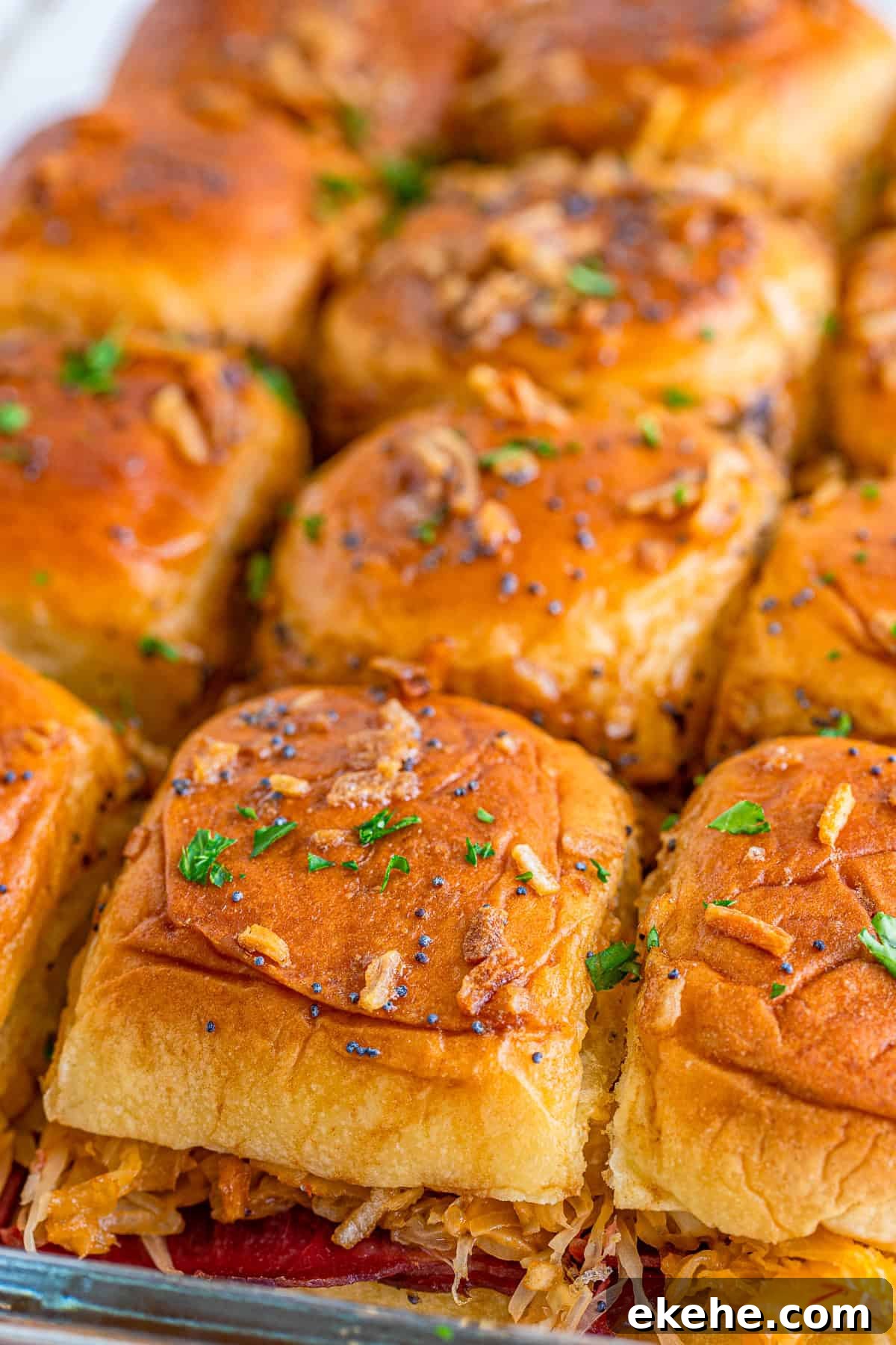 Close up of finished sliders in baking dish.