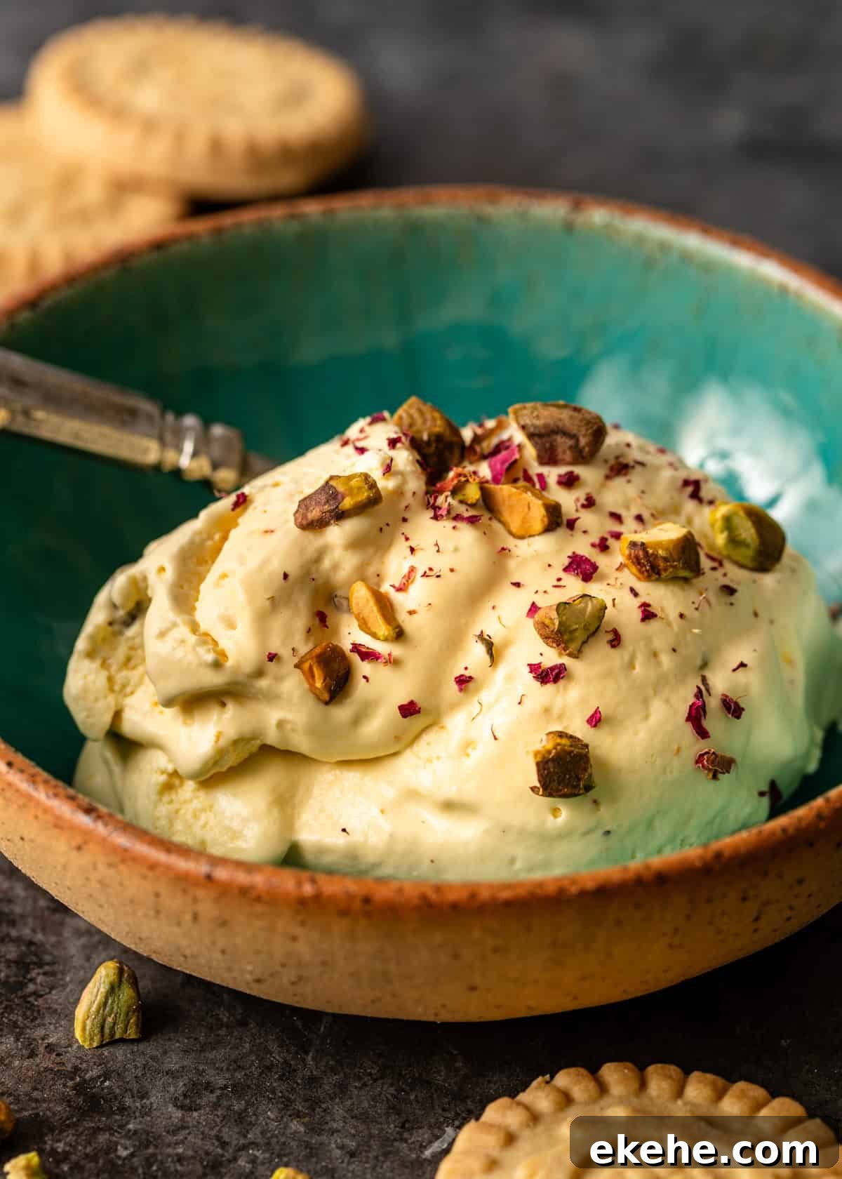 closeup side view: a serving of my persian ice cream recipe topped with nuts and rose petals