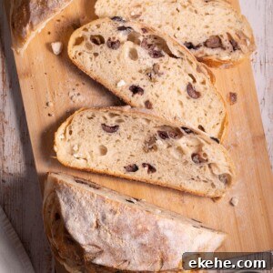 Slices of homemade sourdough bread filled with olives and feta cheese