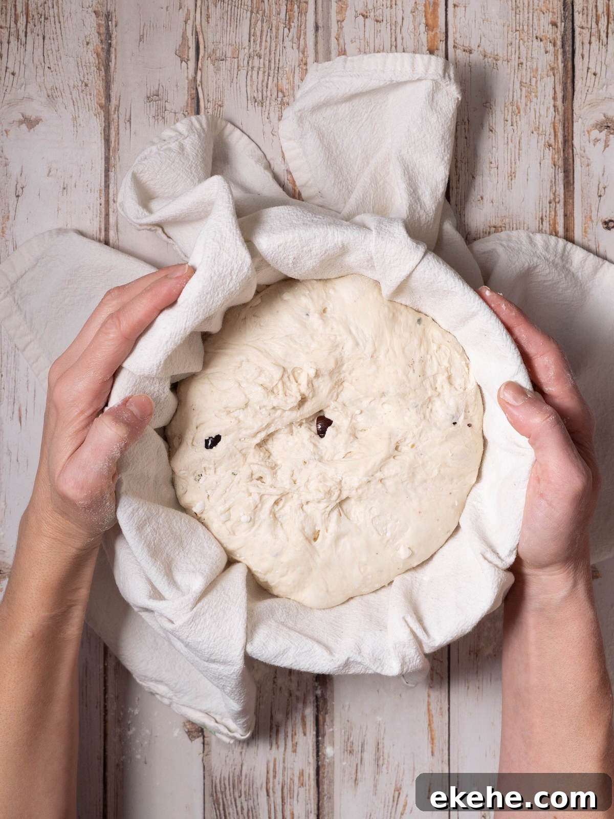 Shaped sourdough in a floured bowl