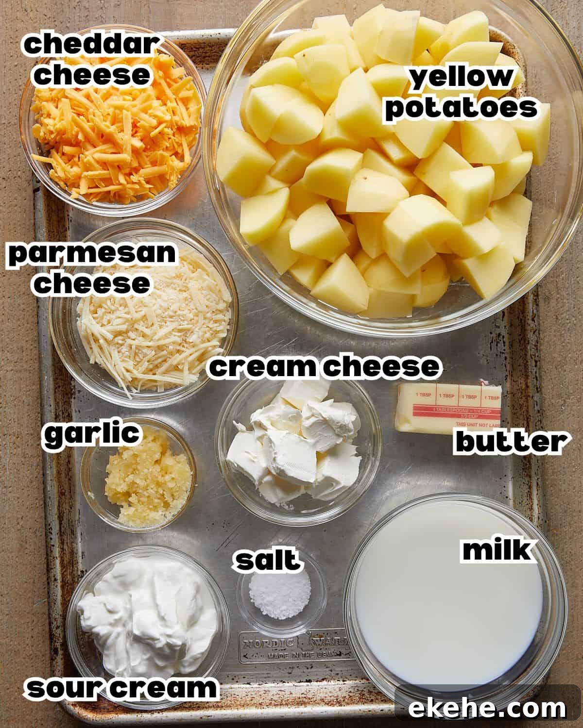 Overhead image of ingredients needed to make cheesy mashed potatoes. 