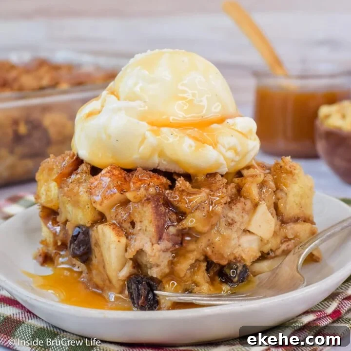 A square of apple dessert casserole topped with ice cream and caramel.