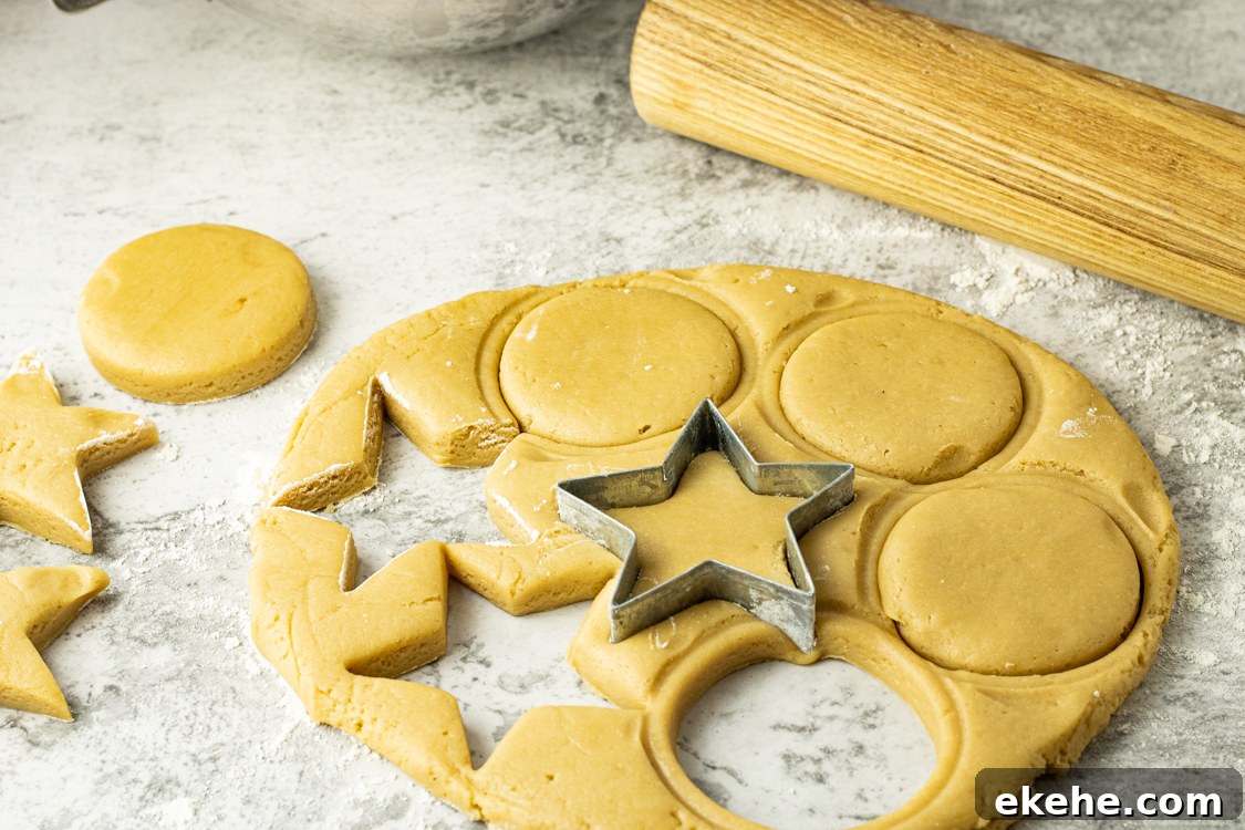 cutting out brown sugar cookies with a cookie cutter