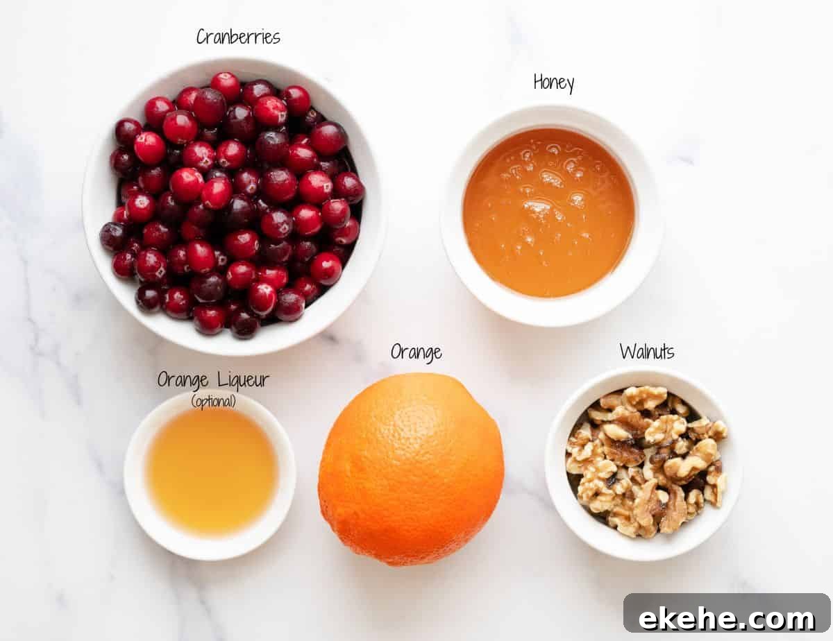 Cranberry Orange Relish Ingredients on a white marble board.