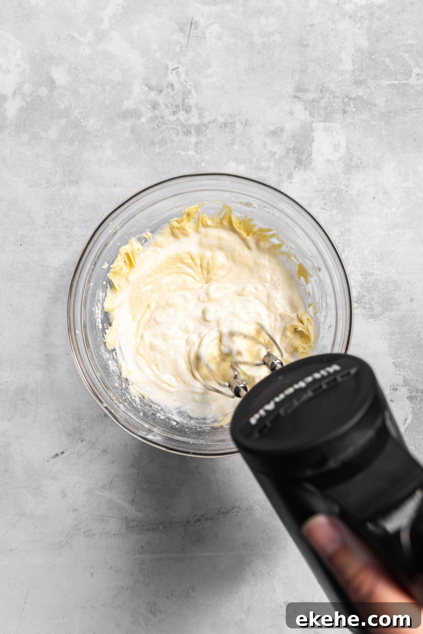 Heavy cream being beaten into cupcake batter
