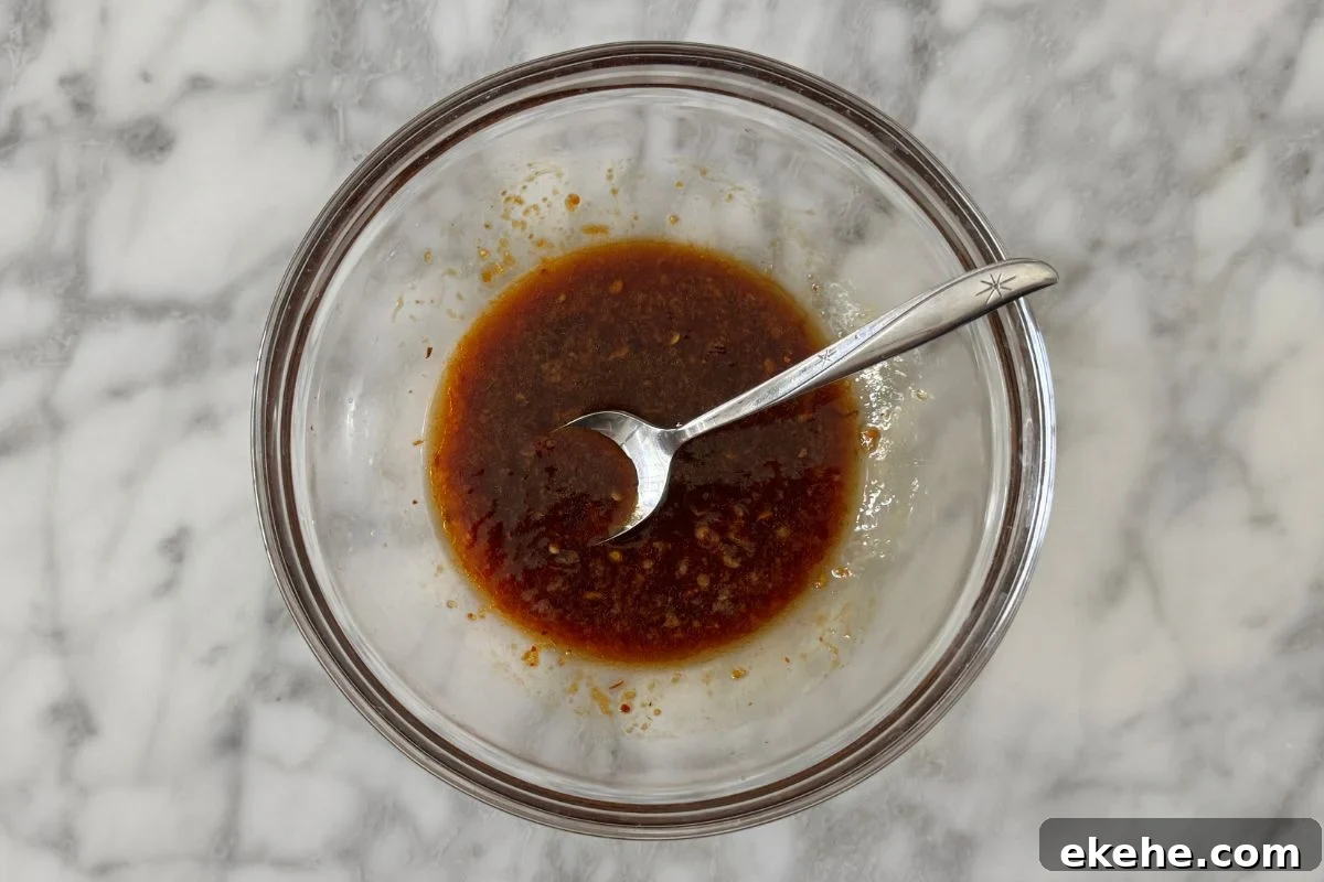 Ingredients for PB2 spicy peanut sauce in a bowl.