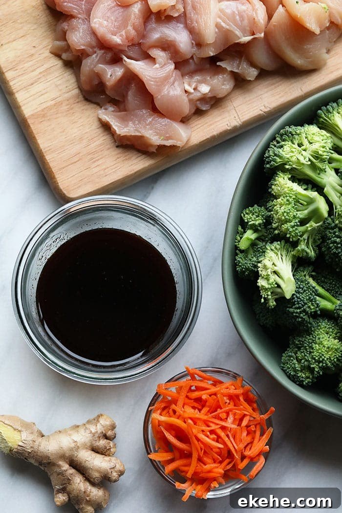 ginger, soy sauce, broccoli, carrots, and chicken breast in bowls