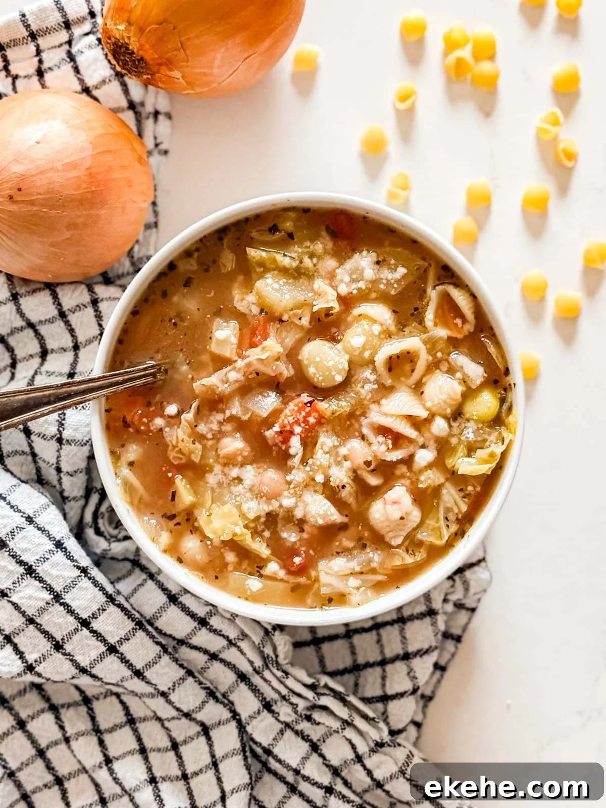 An overhead image of a bowl of minestrone soup.