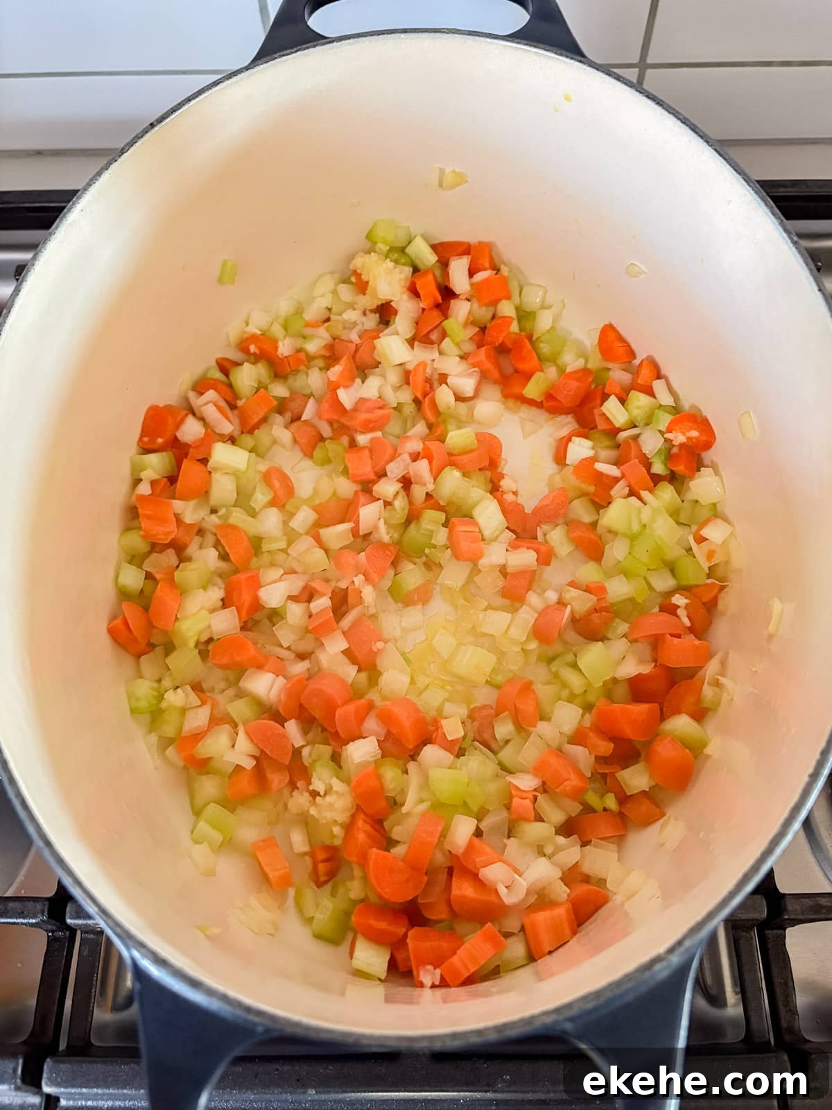 Mirepoix sautéing in a dutch oven.