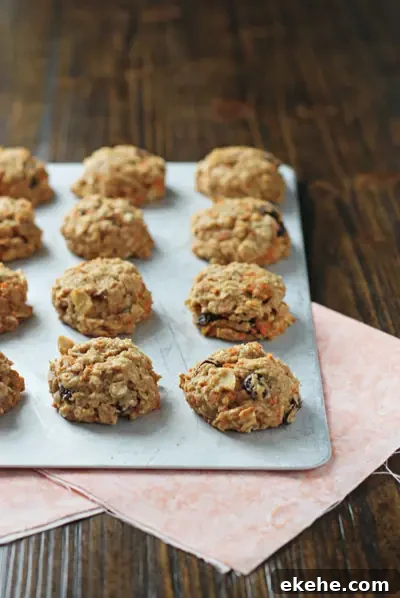 A baking sheet filled with Healthy Carrot Cookies.