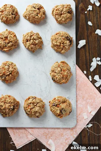 A baking sheet filled with Carrot Oatmeal Cookies with one missing.