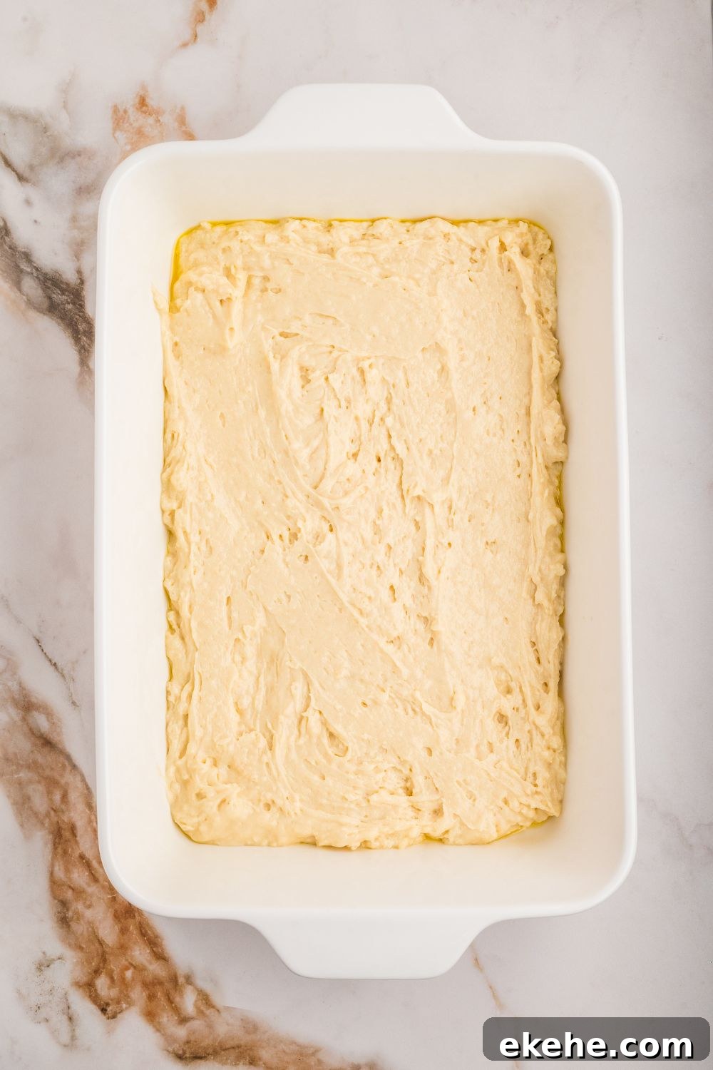 cake batter in a casserole dish 