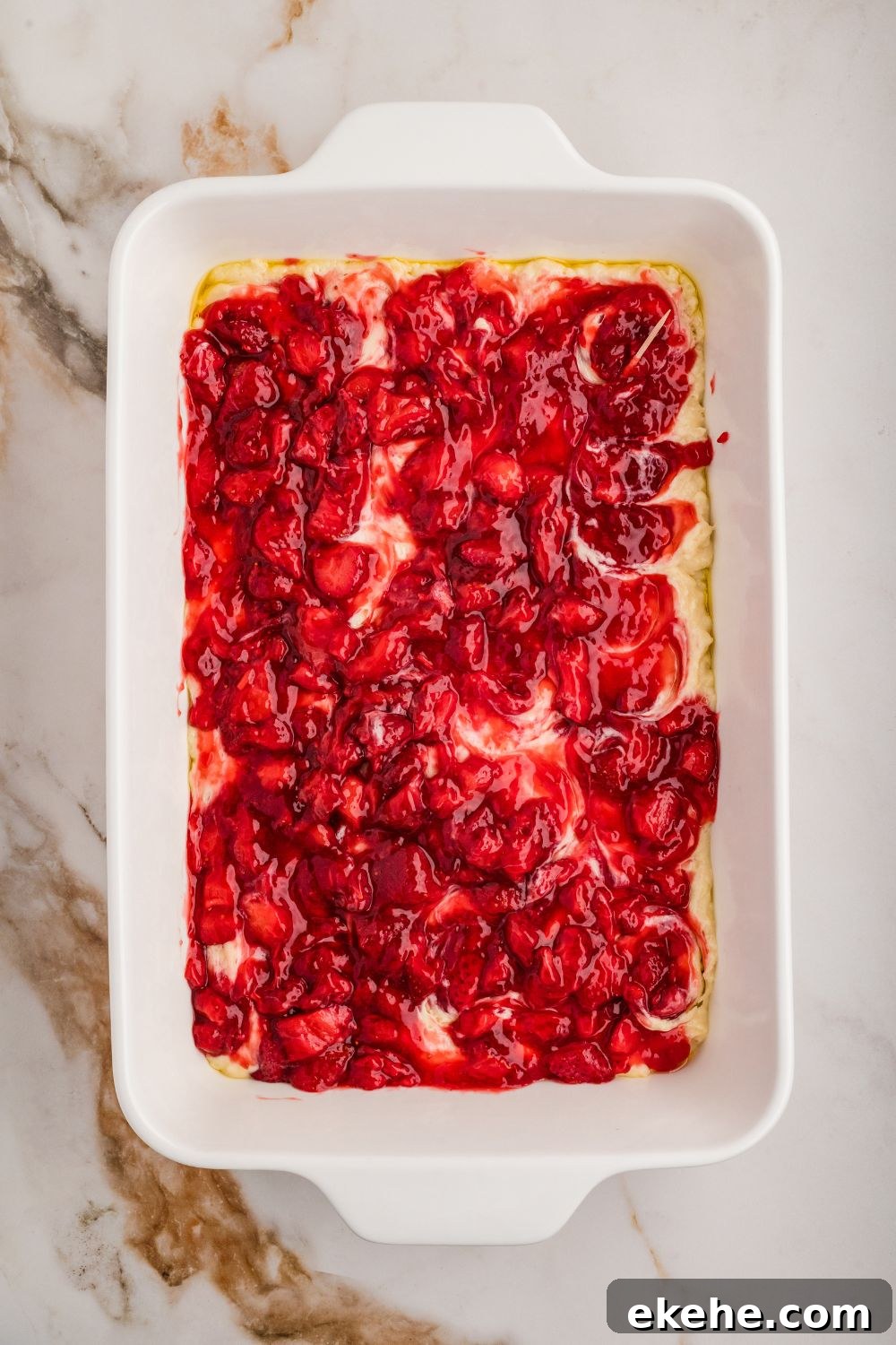 fruit topping on top of raw cake for Strawberry Coffee Cake