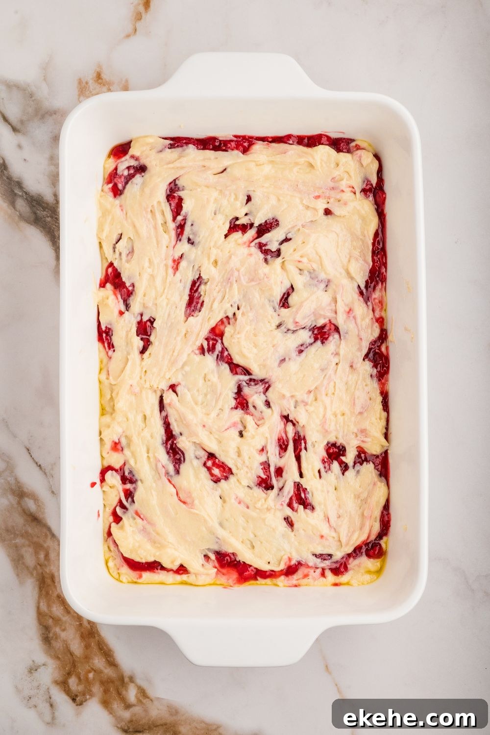 Strawberry Coffee Cake raw batter in a casserole dish 