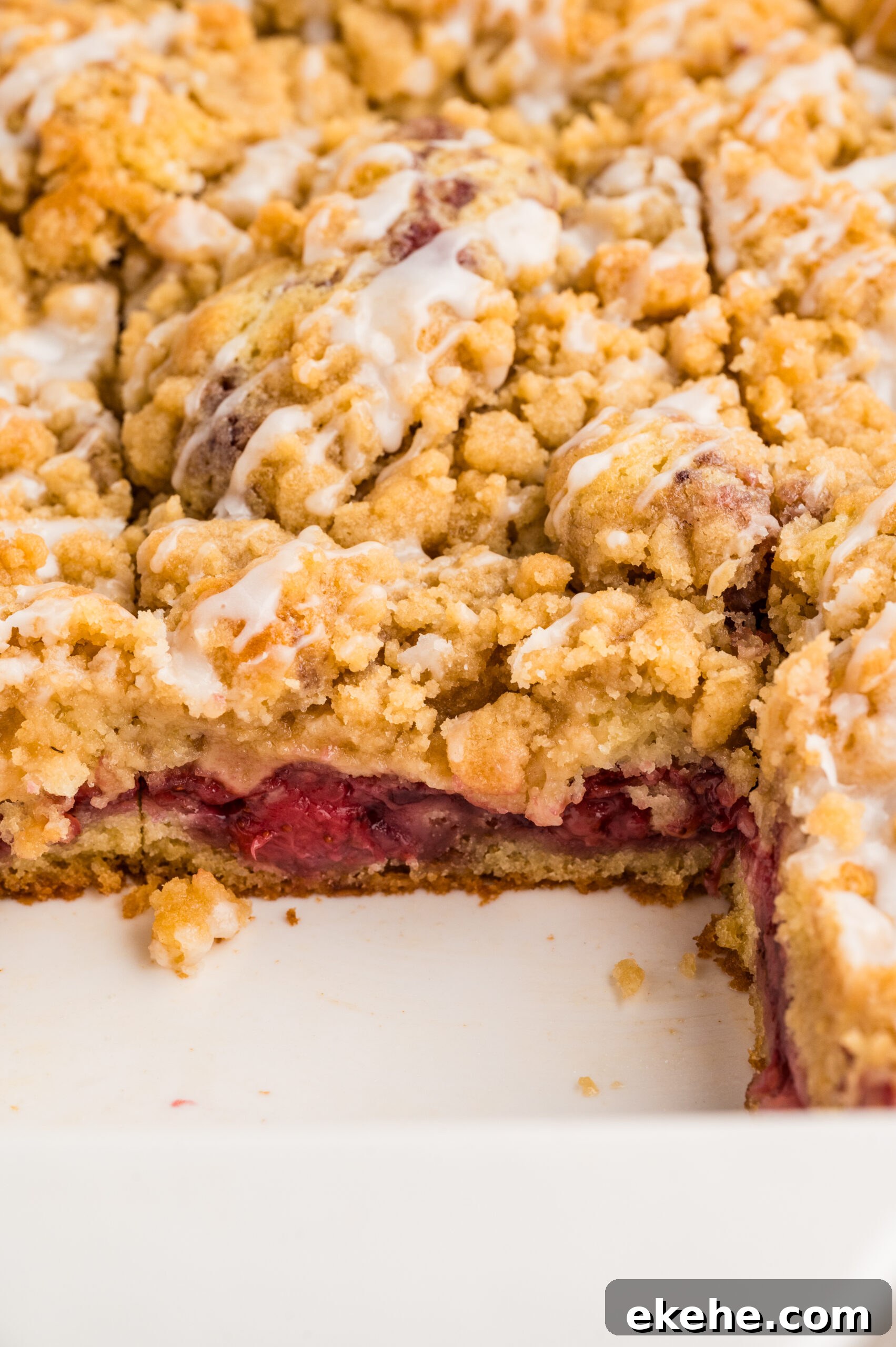 Strawberry Coffee Cake in a baking pan up close to show topping 