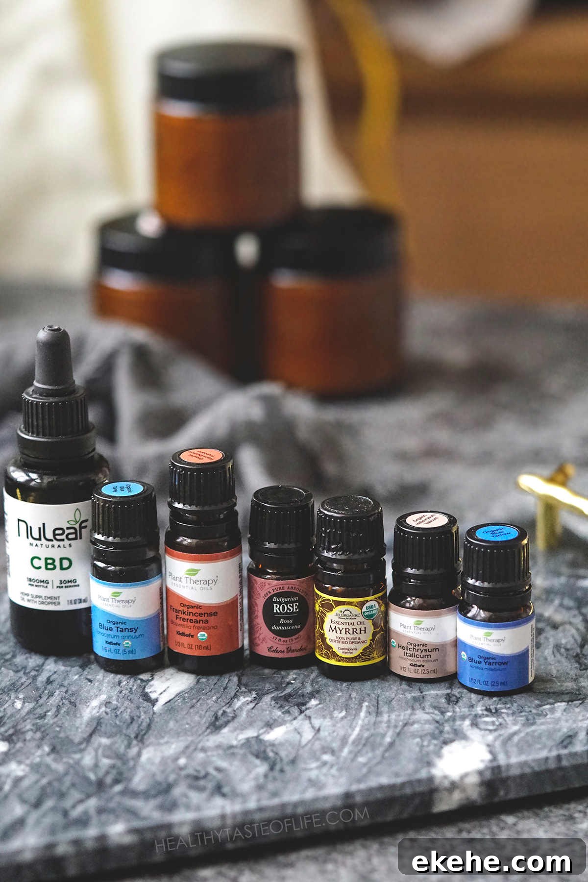 A collection of essential oils used in homemade moisturizer.