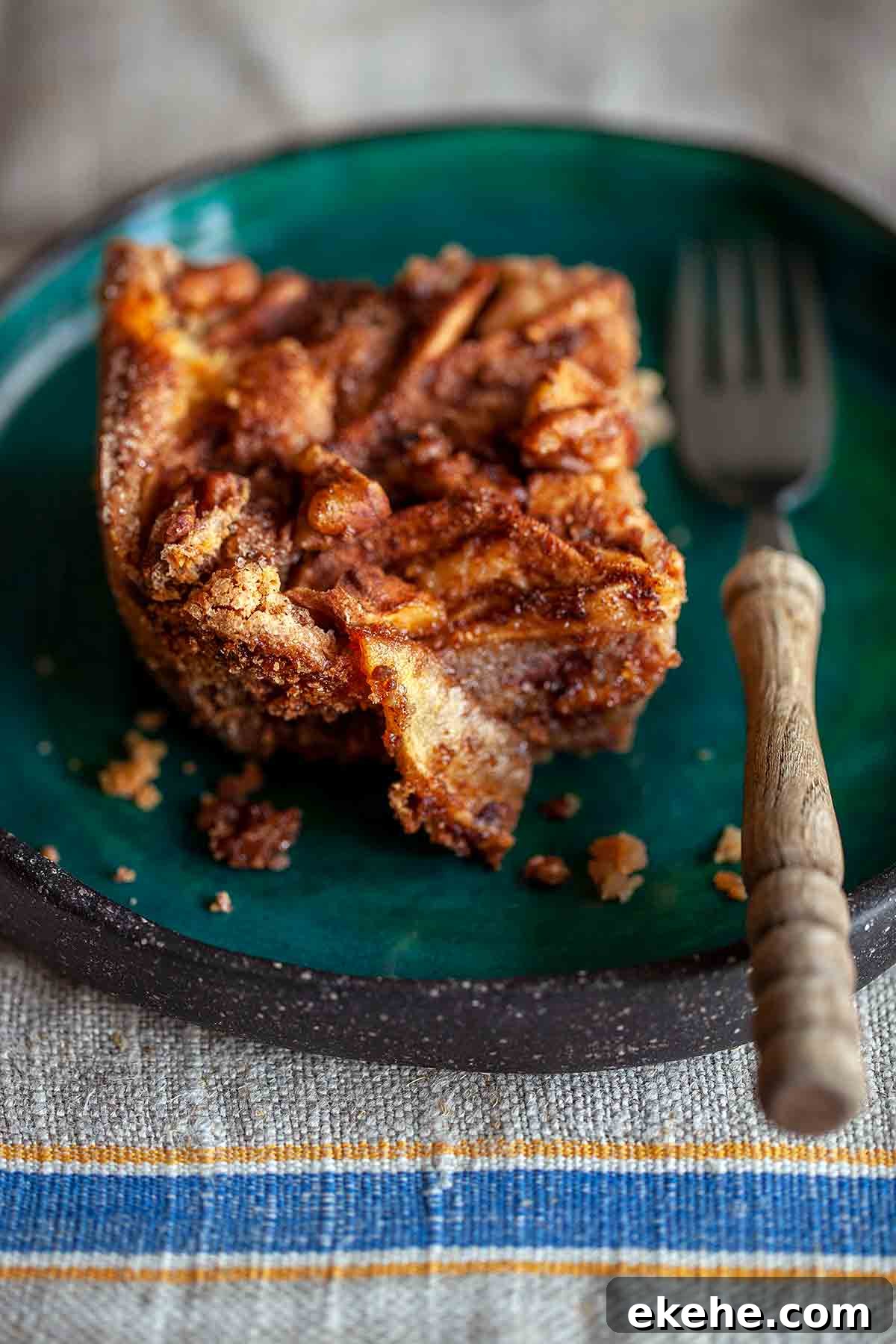 A square of Passover apple cake on a green plate.