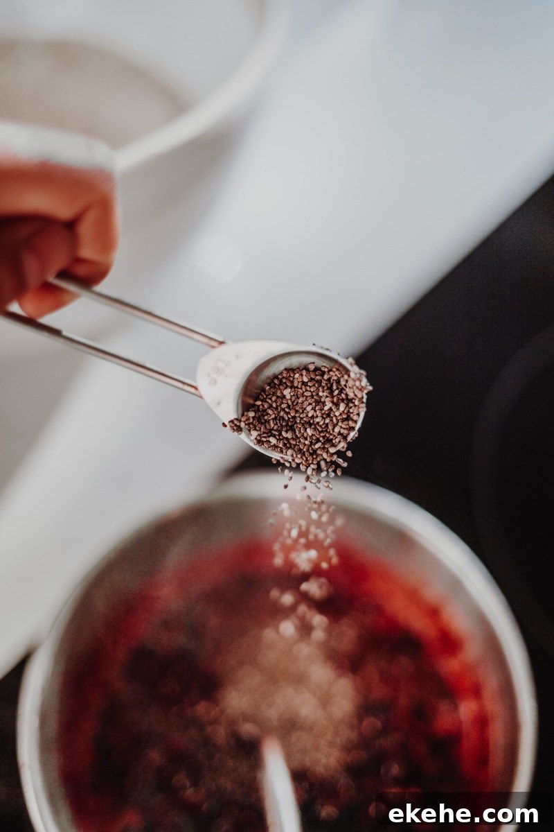 adding the chia seeds into the blackberries