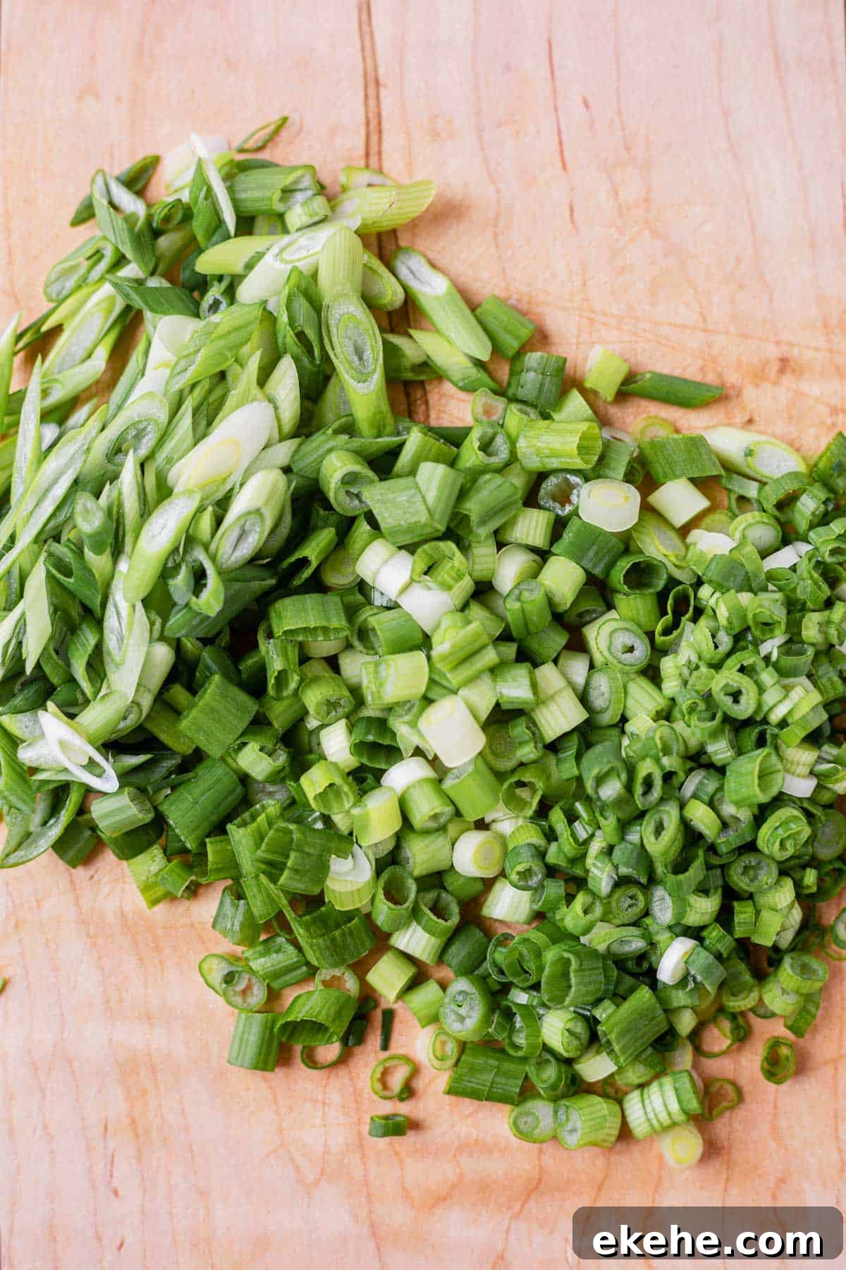 green onions cut into small pieces and cut on the bias on a cutting board