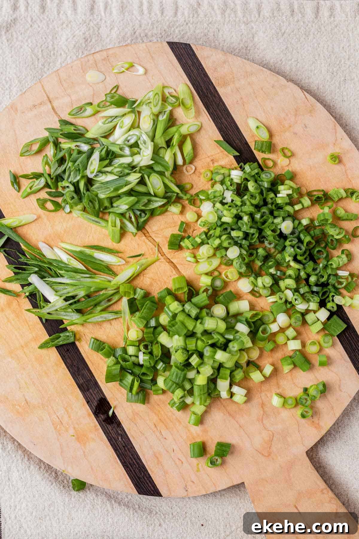 green onions on a cutting board cut up 3 different ways